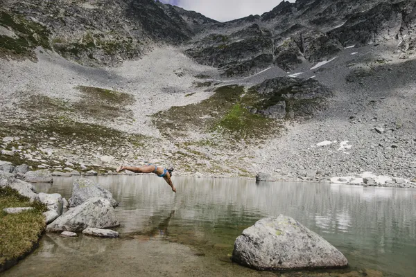 A person diving into water